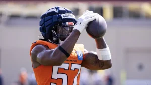 Dre Greenlaw Injury Sends Shockwaves Through Broncos Camp, Threatening Defensive Supremacy Hopes