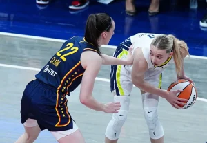 Paige Bueckers Channels Kyrie Irving in Quest to Break Caitlin Clark’s Rookie Scoring Record